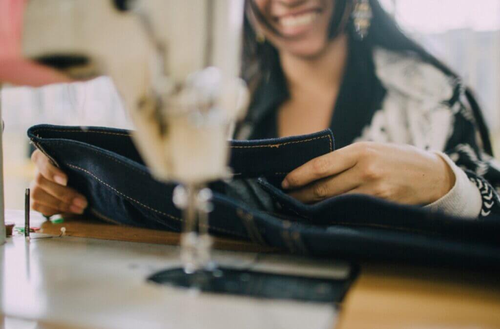 girl sewing jeans