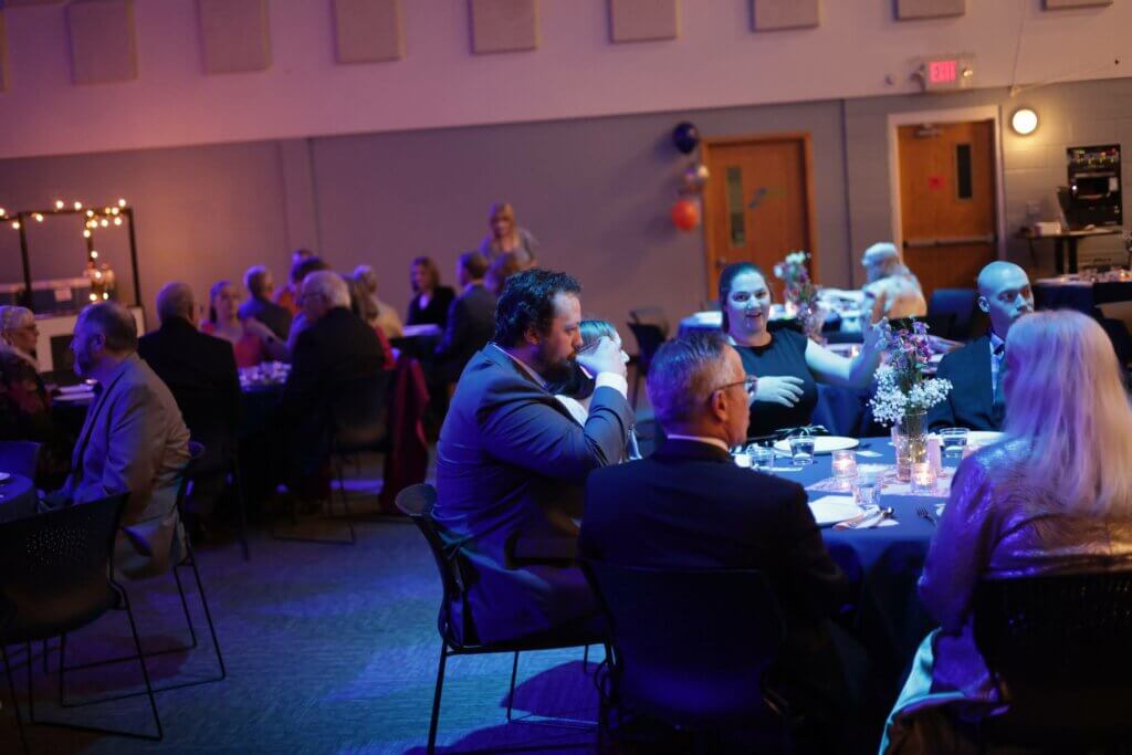 Attendees enjoying dinner